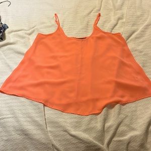 Bright salmon colored tank top with adjustable straps
